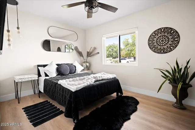 a bedroom with a bed and a window