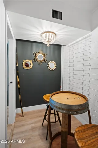 a view of a room that has a table and chairs