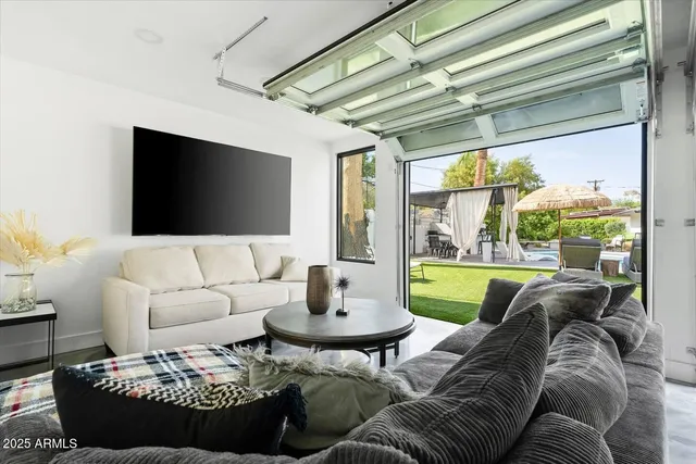 a living room with furniture and a large window