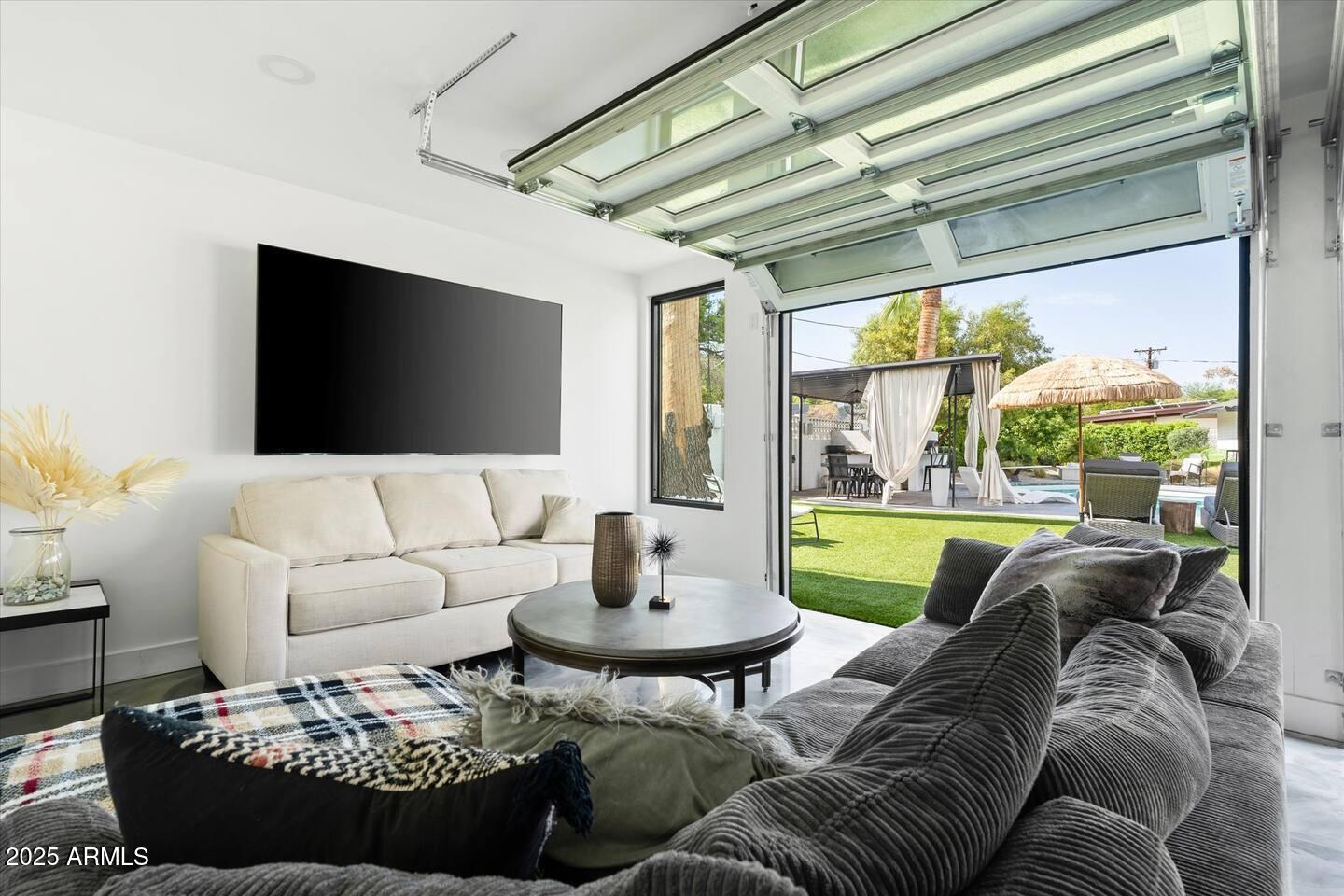 7508 North 13th Avenue Phoenix, AZ 85021 - Photo 35 of 36 a living room with furniture and a large window