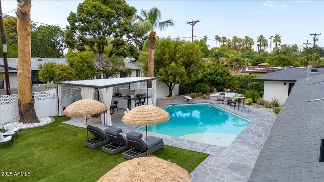 an outdoor space with furniture and garden