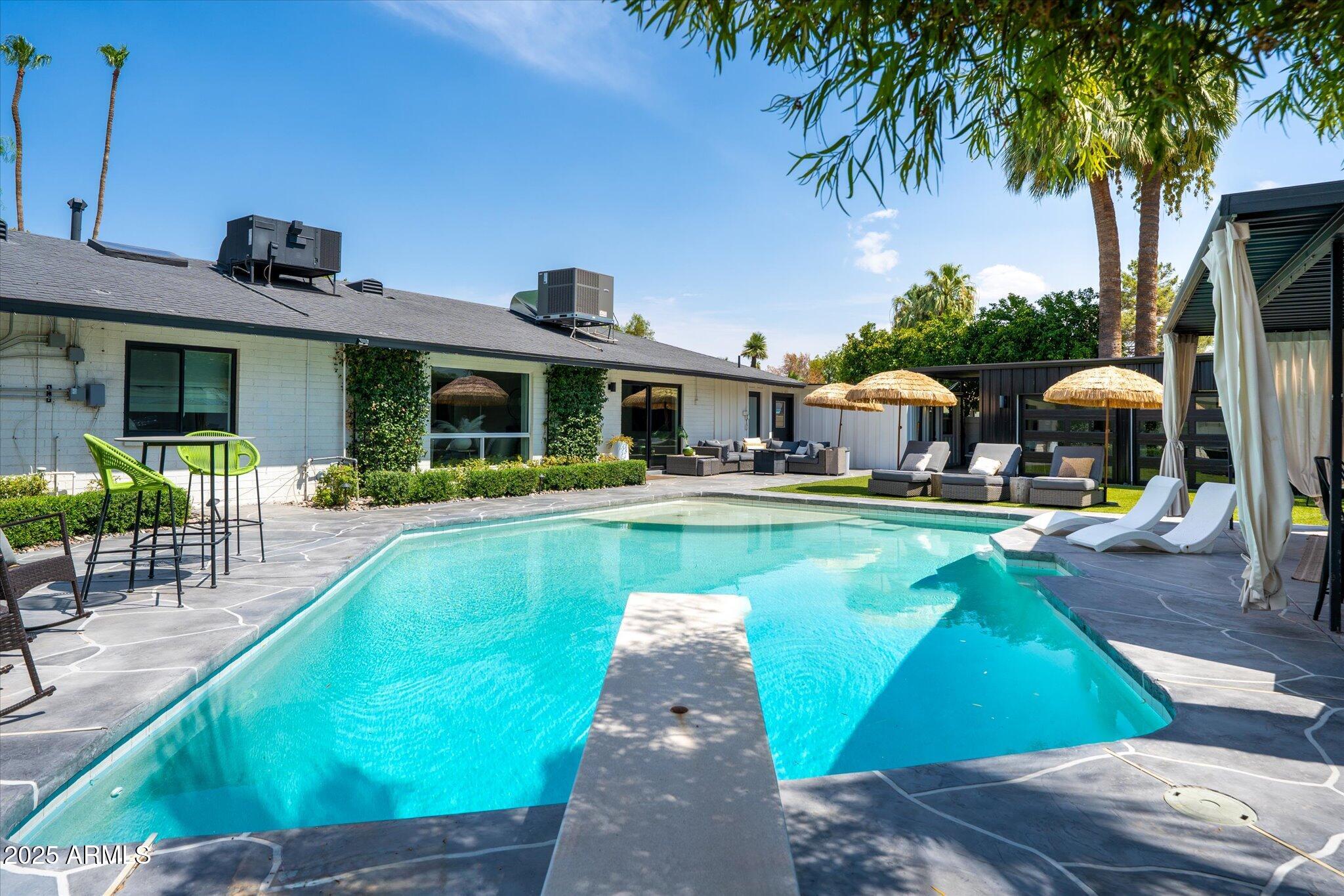 7508 North 13th Avenue Phoenix, AZ 85021 - Photo 6 of 36 a view of a house with swimming pool and sitting area