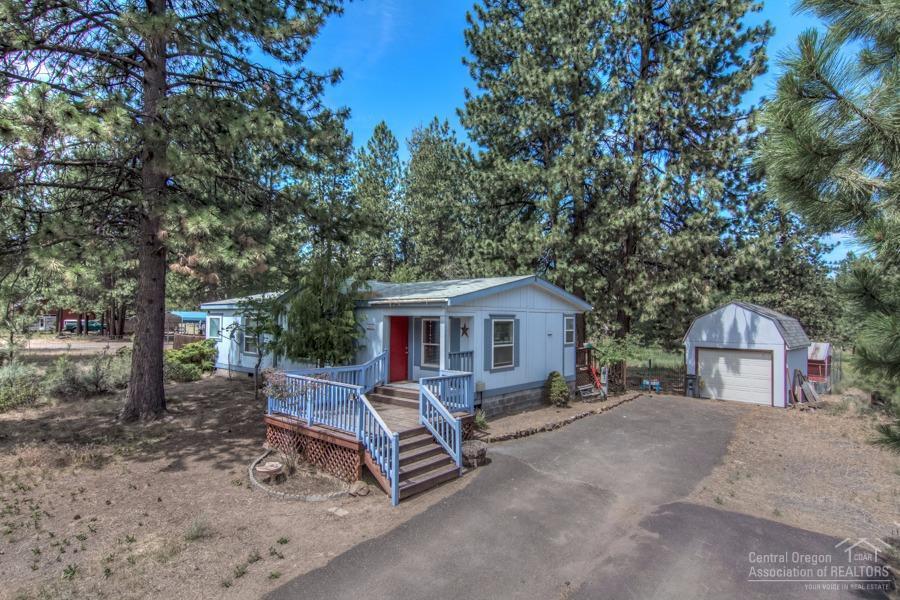 60041 Hopi Road Bend, OR 97702 - Photo 1 of 19 a house view with a sitting space and garden
