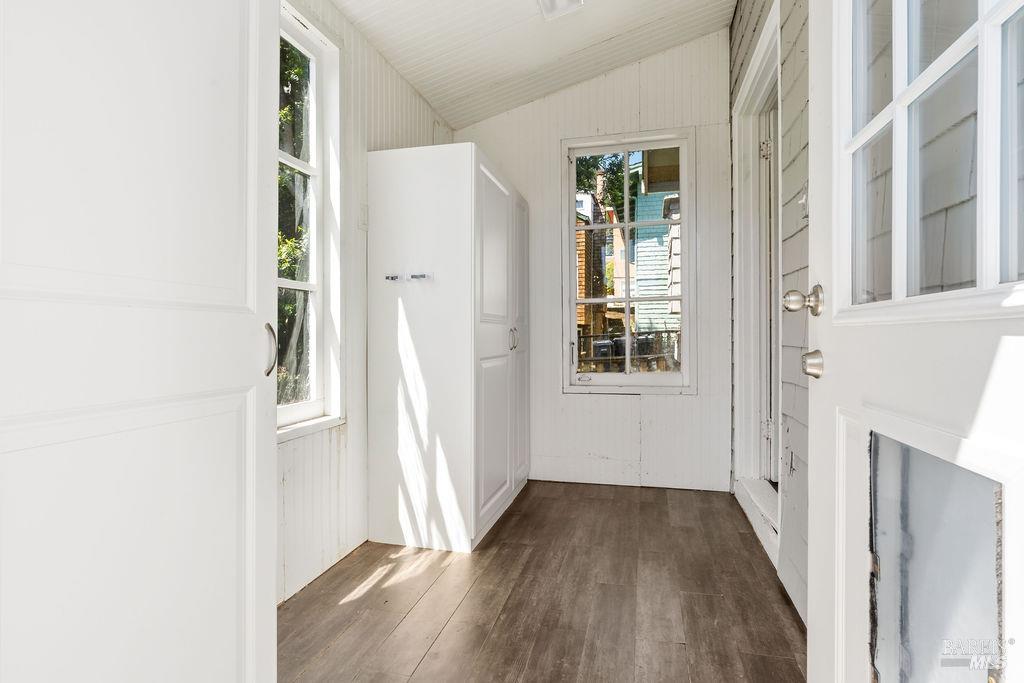 411 Main Street Sausalito, CA 94965 - Photo 11 of 33 Sun porch with storage cabinets lead to back stairs which take you down to the gorgeous garden & yard plus the big basement and laundry.