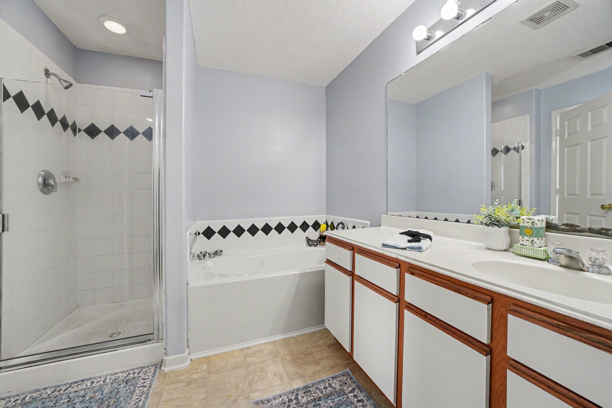 5622 Wasabi Lane Baytown, TX 77521 - Photo 15 of 29 a bathroom with a sink and mirror
