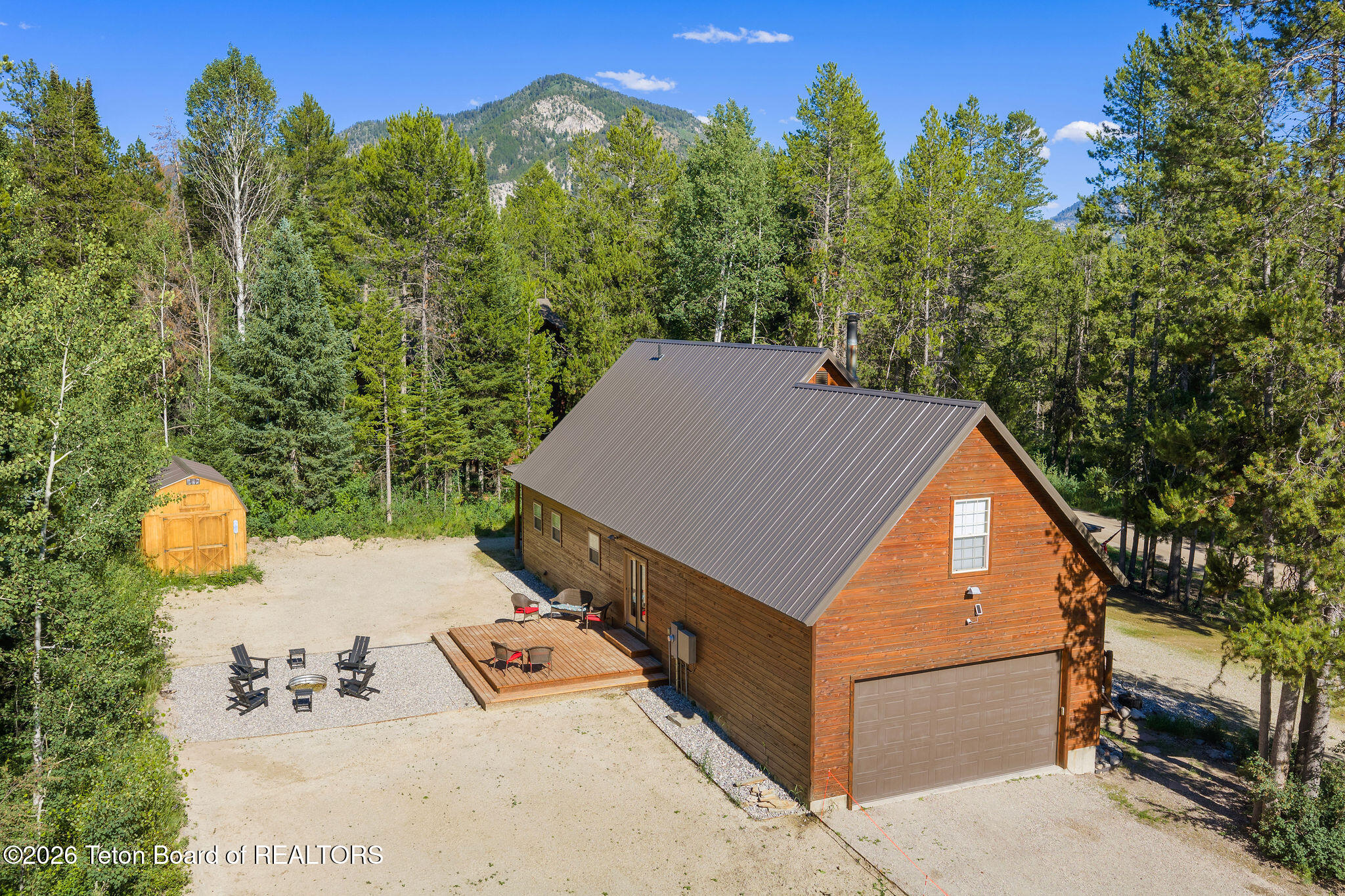 9 Pine Street Alpine, WY 83128 - Photo 10 of 78 Backyard Firepit and new deck