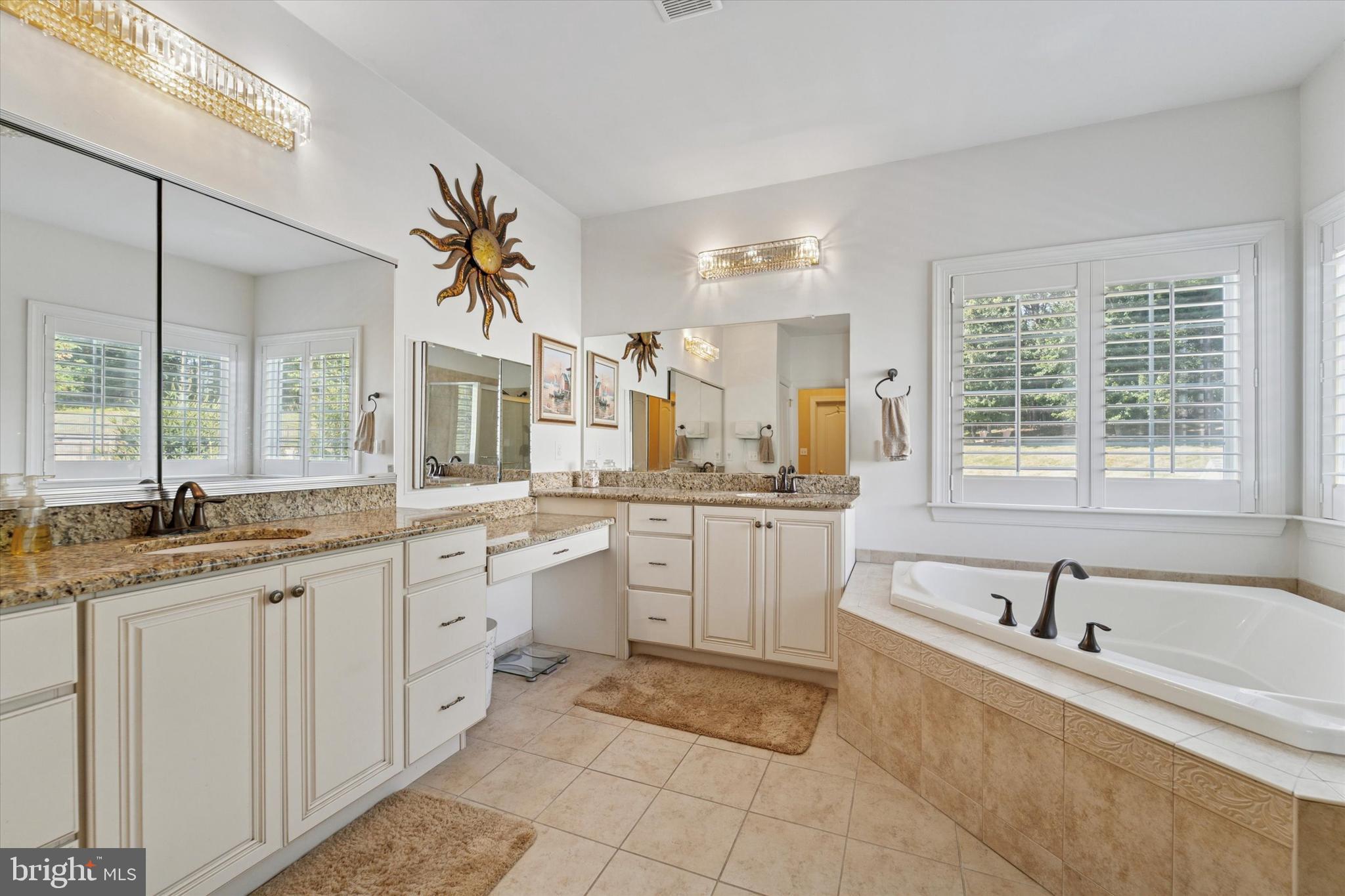 2001 Grenoble Road Coatesville, PA 19320 - Photo 30 of 45 a large bathroom with a granite countertop sink mirror and a bathtub