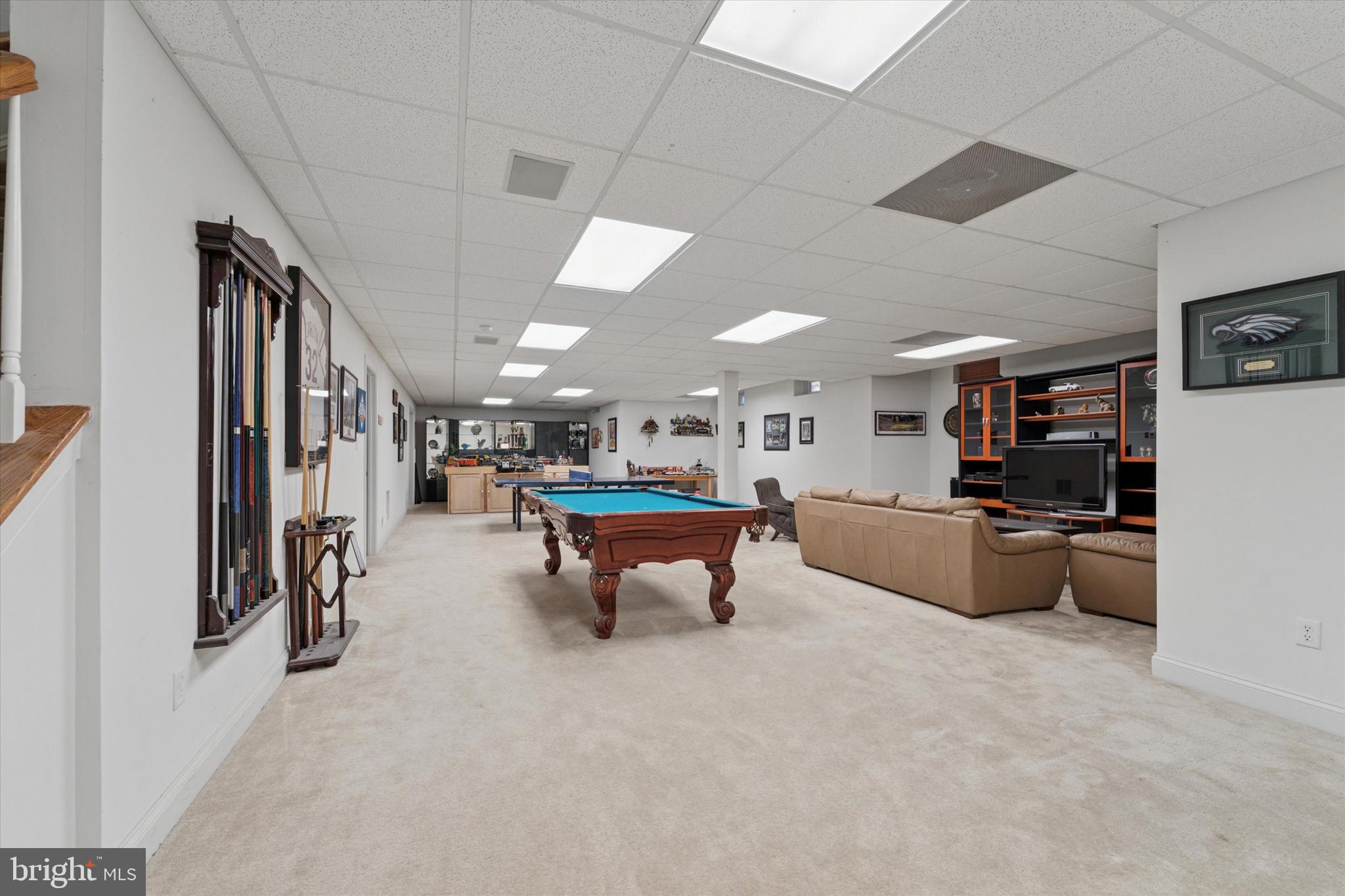 2001 Grenoble Road Coatesville, PA 19320 - Photo 32 of 45 a living room with furniture and a flat screen tv