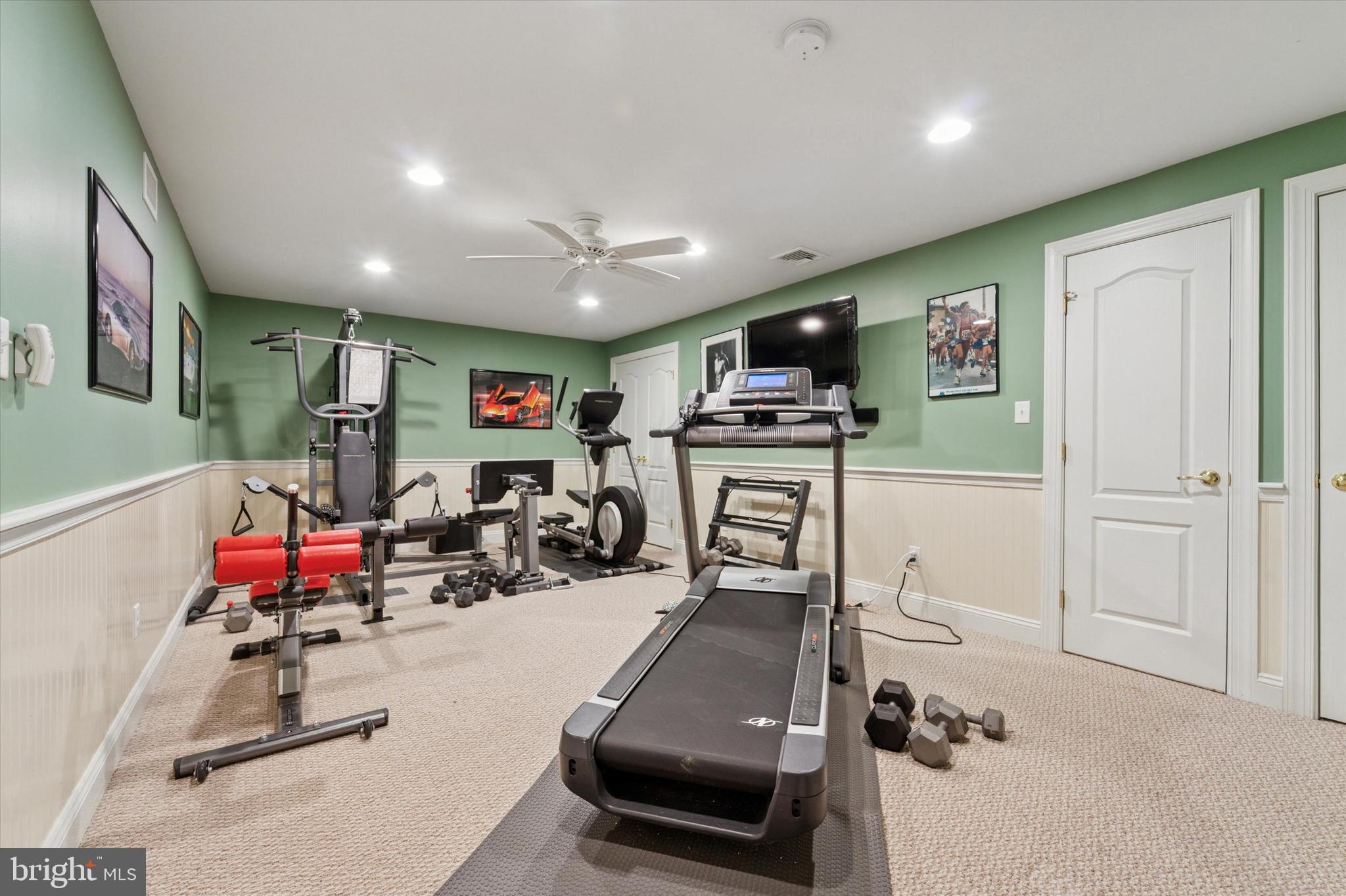 2001 Grenoble Road Coatesville, PA 19320 - Photo 36 of 45 a room with gym equipment and a flat screen tv