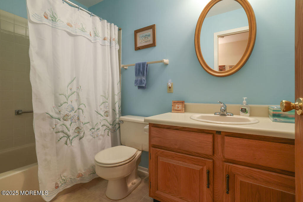 3 B Alpine Road, Unit 63 Whiting, NJ 08759 - Photo 15 of 26 a bathroom with a toilet sink vanity and mirror