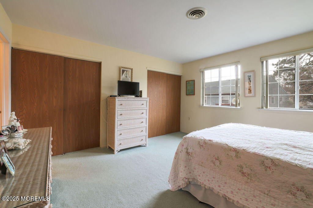 3 B Alpine Road, Unit 63 Whiting, NJ 08759 - Photo 18 of 26 a bedroom with a bed dresser and a window