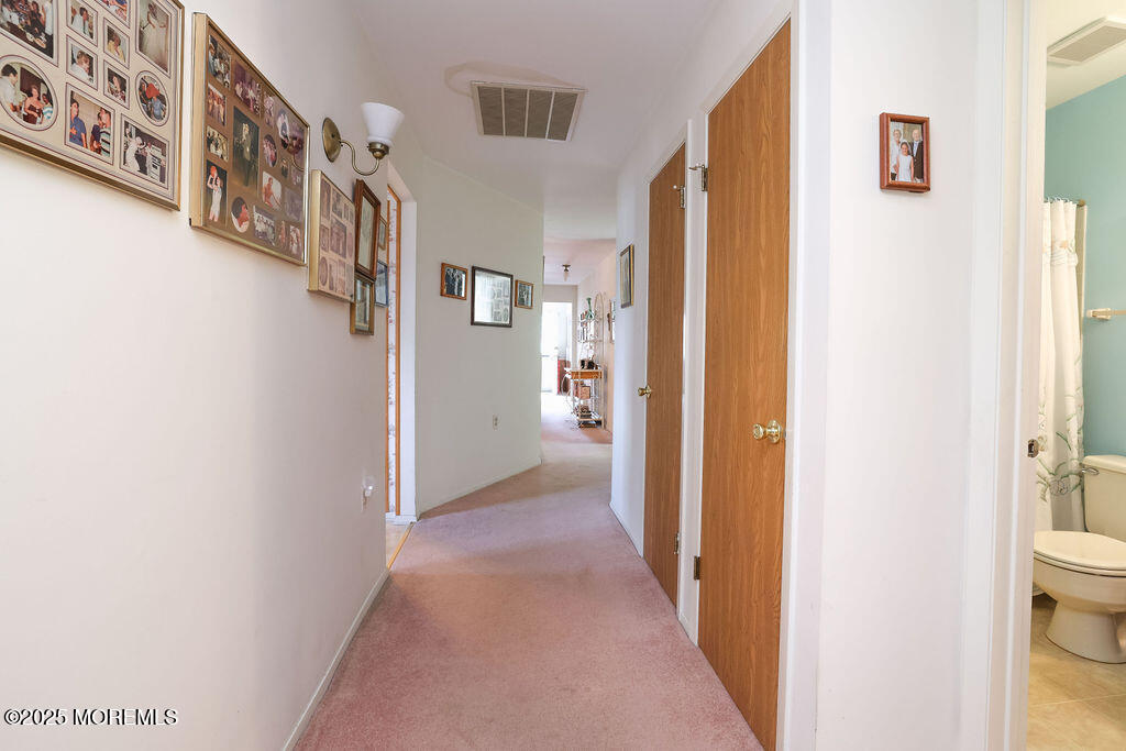 3 B Alpine Road, Unit 63 Whiting, NJ 08759 - Photo 23 of 26 a view of a hallway with a white walls