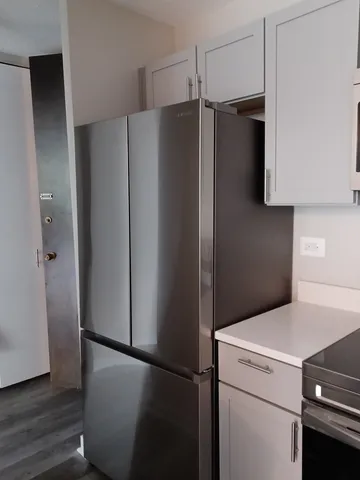 a close view of a refrigerator and a refrigerator in kitchen
