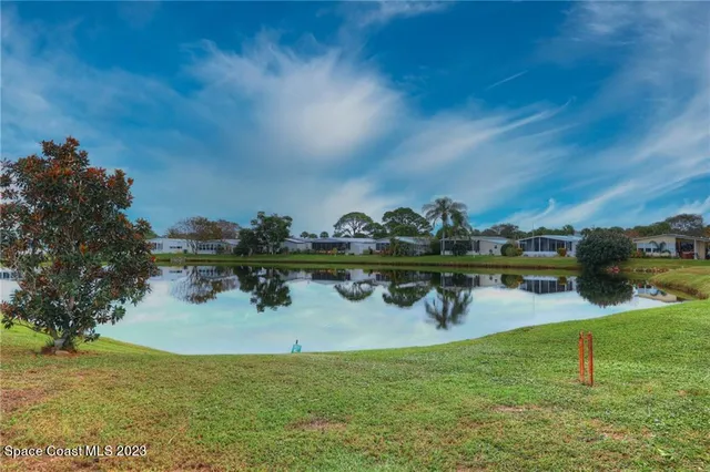 a view of swimming pool with outdoor seating