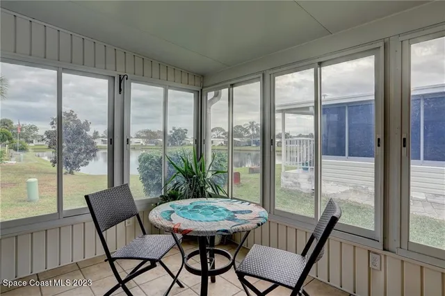 a view of a room with a furniture and balcony