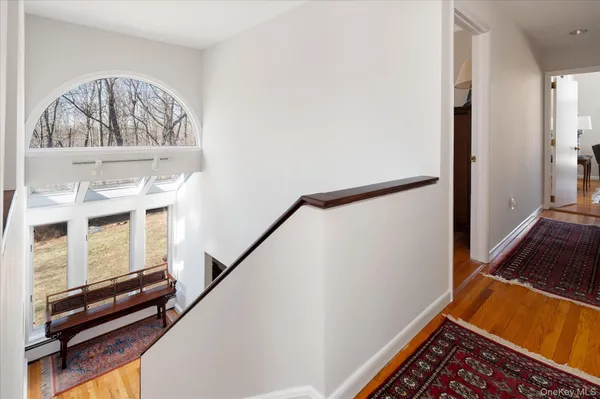 a view of an entryway with wooden floor