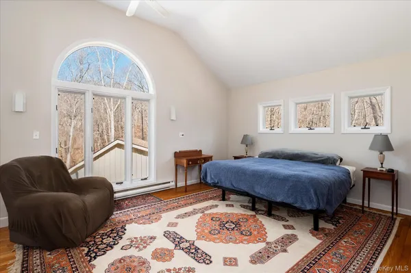 a bedroom with furniture and a window