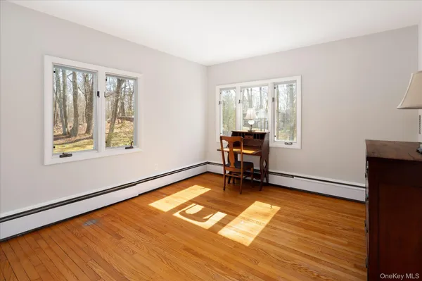 a view of room with window wooden floor and couch
