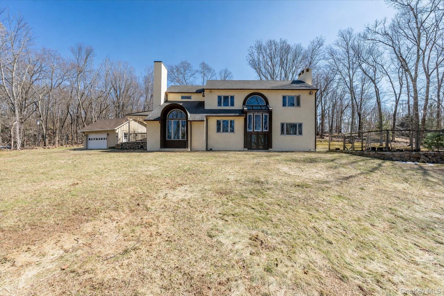 17 Highview Road Pound Ridge, NY 10576 - Photo 19 of 23 a front view of a house with a yard