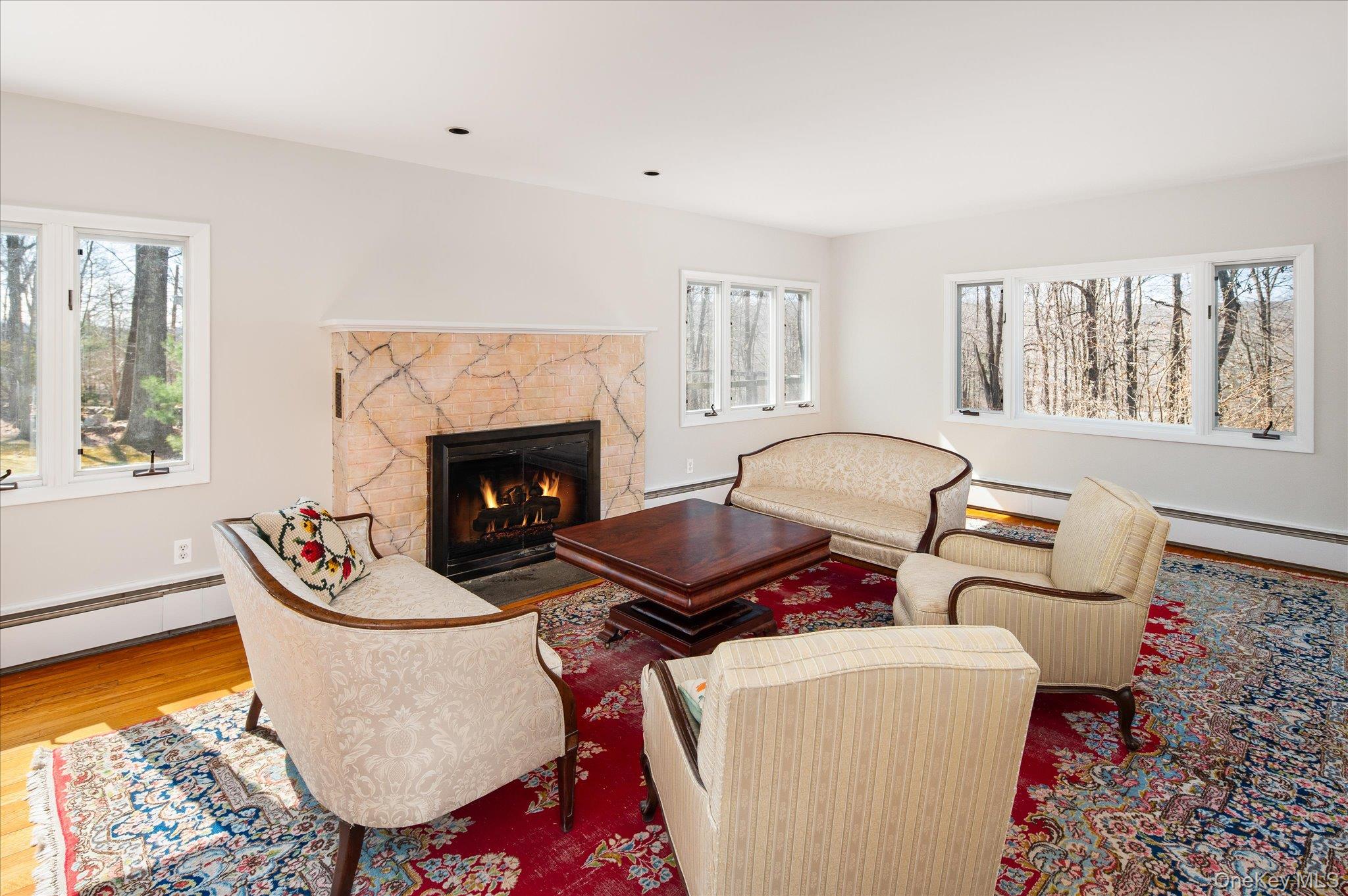 17 Highview Road Pound Ridge, NY 10576 - Photo 8 of 23 a living room with furniture fireplace and window