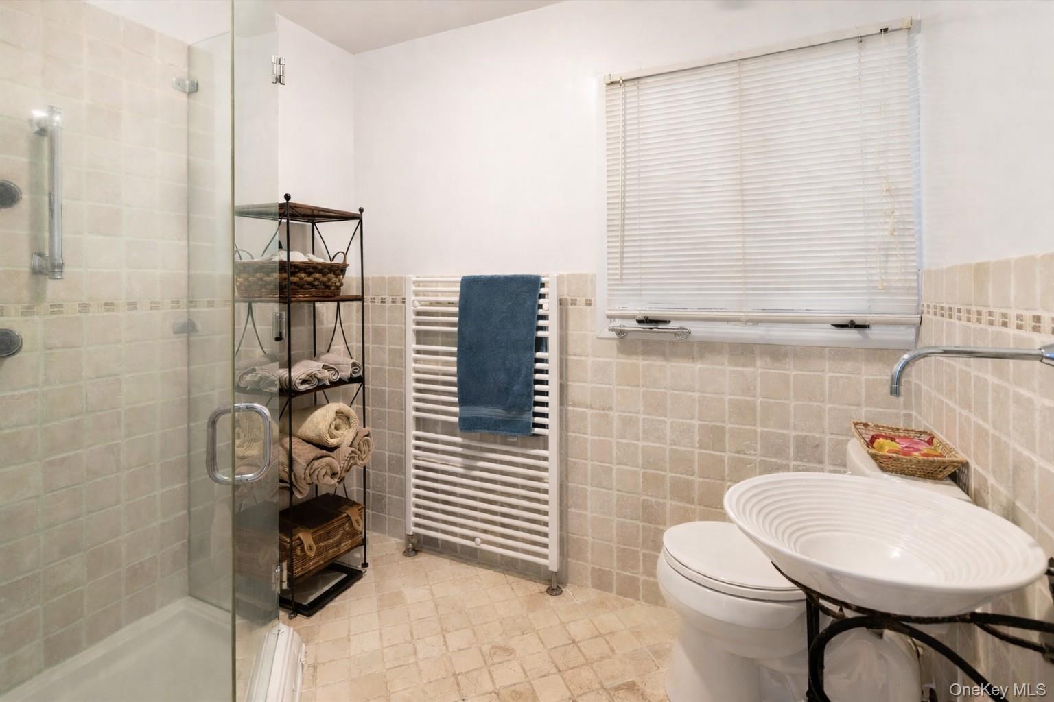 17 Highview Road Pound Ridge, NY 10576 - Photo 10 of 23 a bathroom with a sink toilet and shower