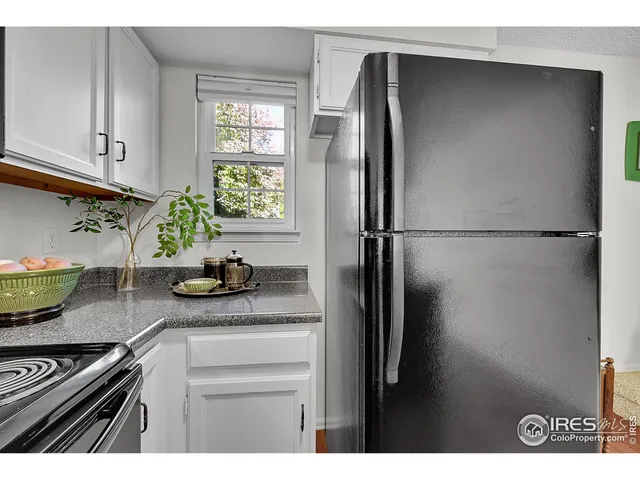 a bed room with a bed and a chair