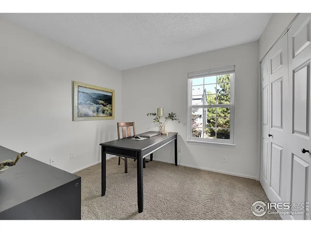 a view of a livingroom with furniture and window