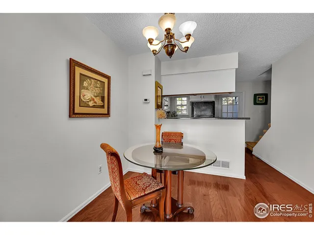 a dining room with furniture and chandelier