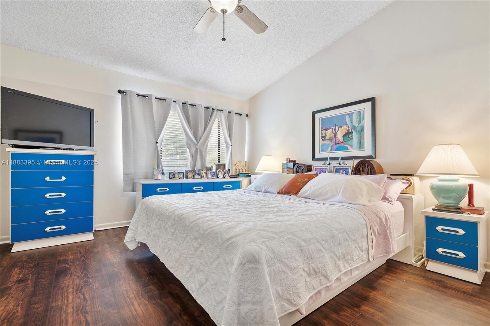 4347 Southwest 70th Terrace Davie, FL 33314 - Photo 13 of 32 a bed room with a bed and a tv