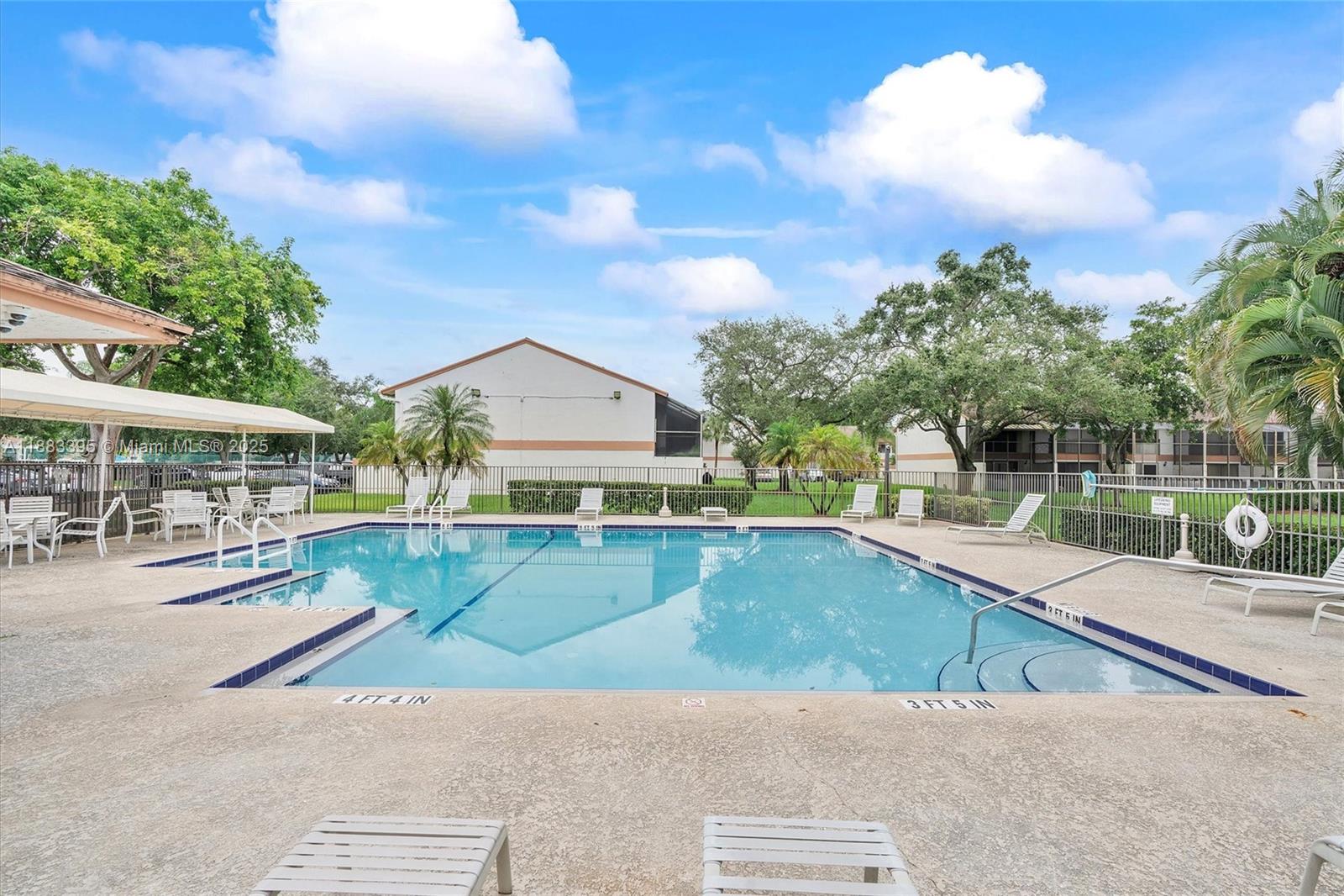 4347 Southwest 70th Terrace Davie, FL 33314 - Photo 30 of 32 a view of a house with swimming pool and sitting area