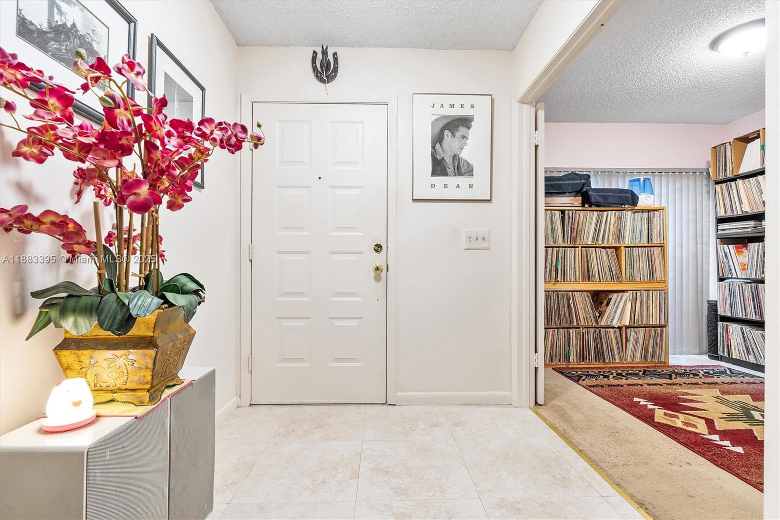 4347 Southwest 70th Terrace Davie, FL 33314 - Photo 5 of 32 a vase of flowers sitting on a floor in a living room