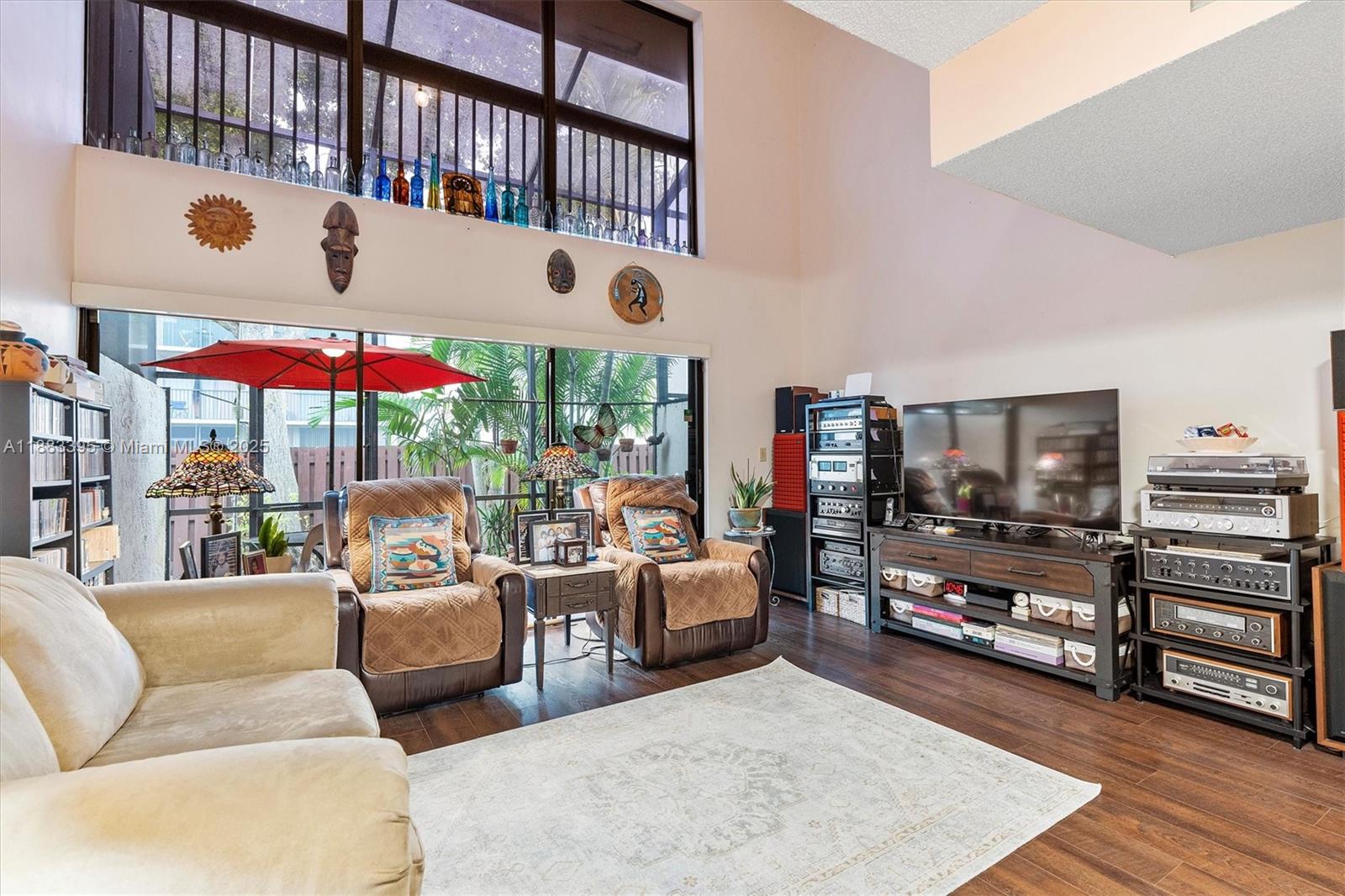 4347 Southwest 70th Terrace Davie, FL 33314 - Photo 6 of 32 a living room with furniture and a flat screen tv