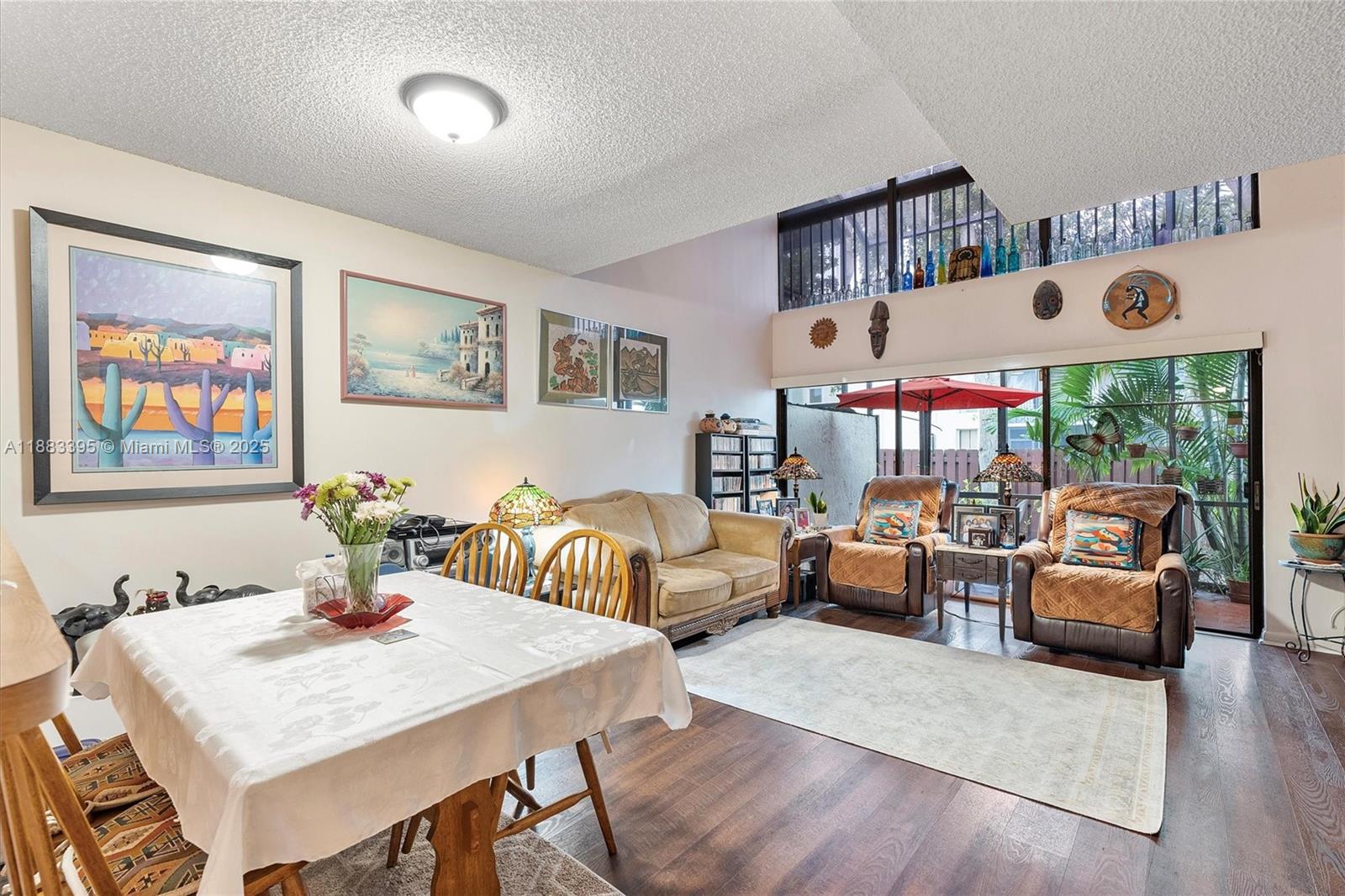 4347 Southwest 70th Terrace Davie, FL 33314 - Photo 7 of 32 a view of a dining room with furniture window and wooden floor