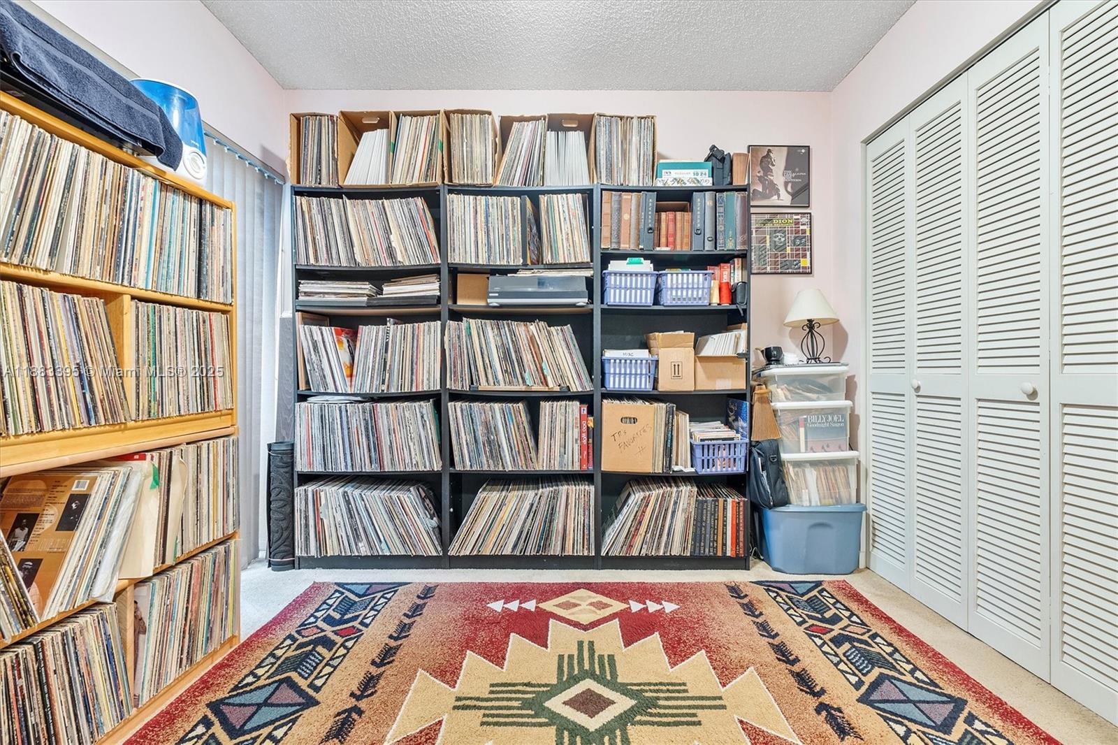 4347 Southwest 70th Terrace Davie, FL 33314 - Photo 9 of 32 a view of a bedroom with furniture book shelf