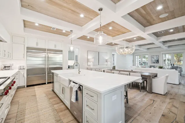 a view of a dining room with furniture wooden floor and chandelier