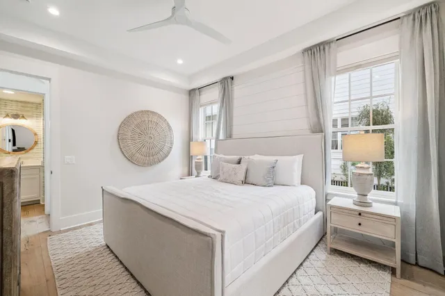 a spacious bedroom with a bed and a large mirror