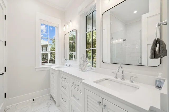 a bathroom with a sink vanity and a mirror