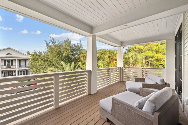 a kitchen with stainless steel appliances granite countertop a sink a stove and a wooden floor