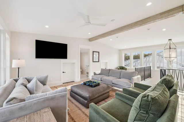 a spacious bathroom with a granite countertop sink mirror and toilet
