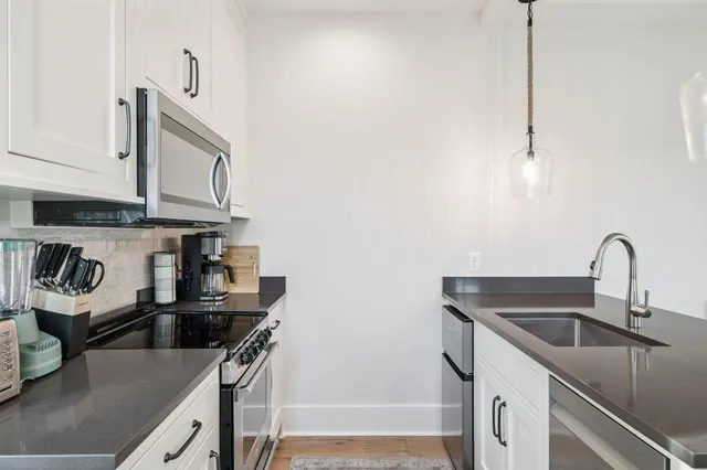 a view of a swimming pool with a yard