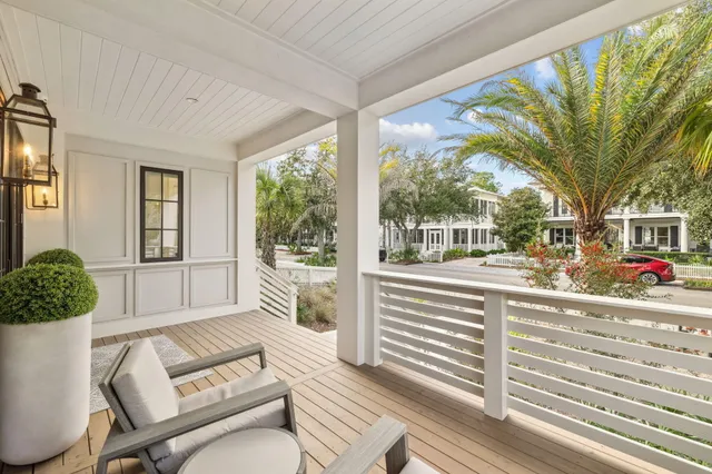 a living room with couch and a floor to ceiling window