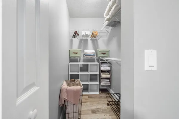 a bathroom with a granite countertop toilet a sink and bathtub