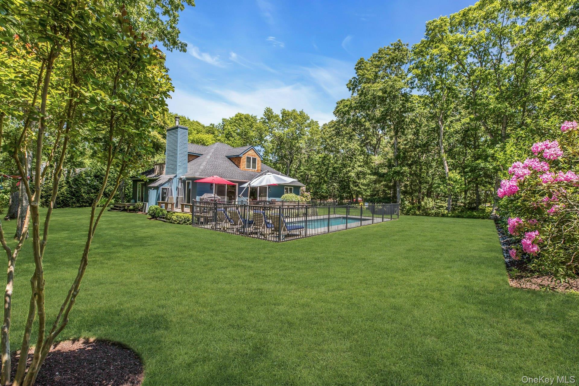 16 Hildreth Road Hampton Bays, NY 11946 - Photo 28 of 29 a view of a house with a yard and sitting area