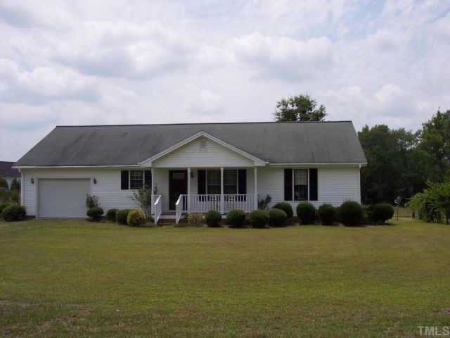 3515 Johnston County Road Angier, NC 27501 - Photo 1 of 6 a front view of a house with garden