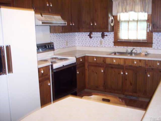3515 Johnston County Road Angier, NC 27501 - Photo 3 of 6 a kitchen with a sink and a window
