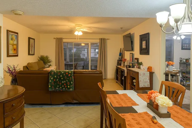 a living room with furniture fireplace and flat screen tv