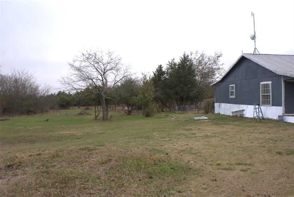 8660 County Road 308 Terrell, TX 75161 - Photo 14 of 18 a view of a house with a yard