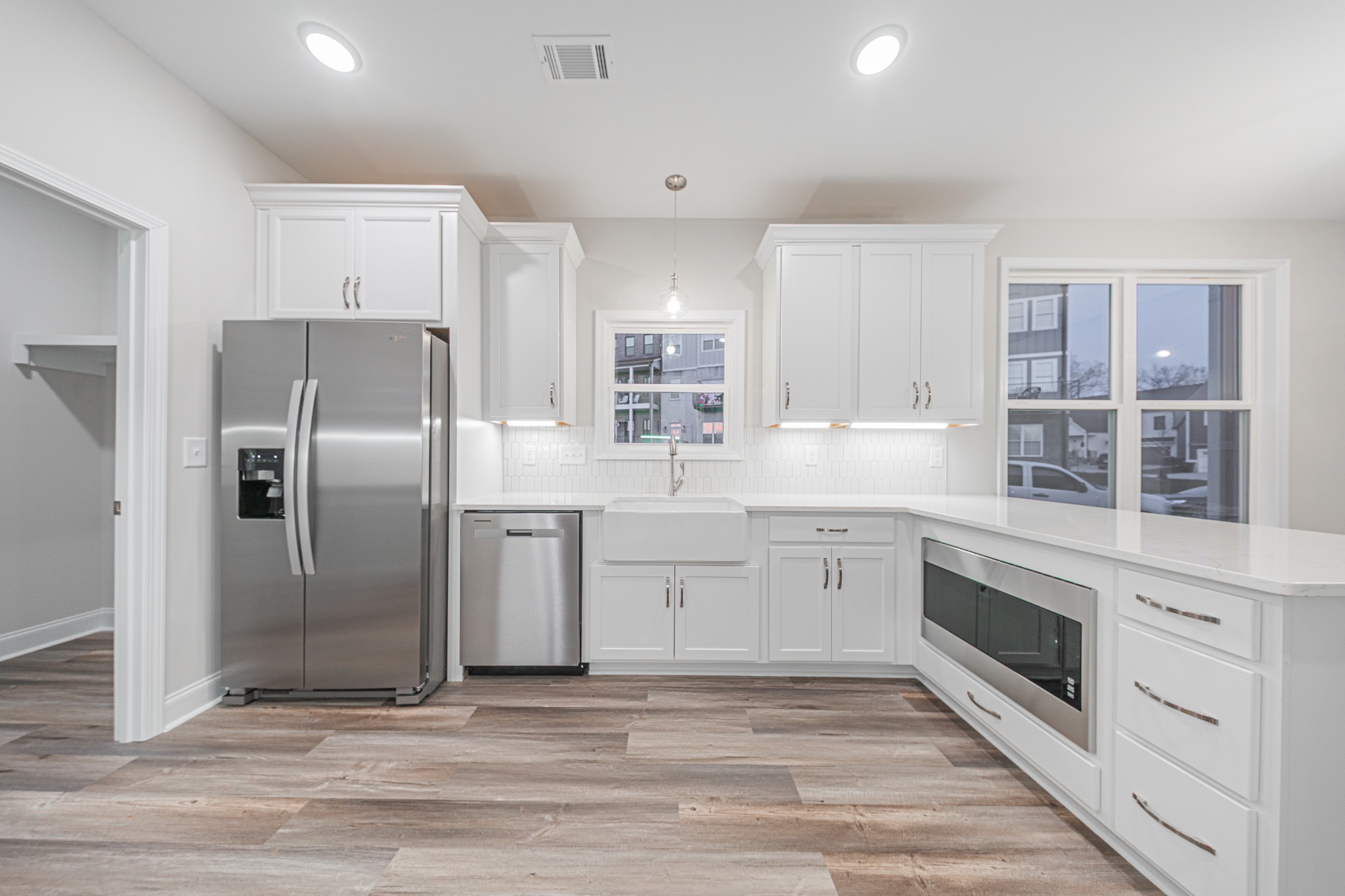 110 Gower Street Pleasant View, TN 37146 - Photo 11 of 32 a kitchen with granite countertop a refrigerator oven and cabinets