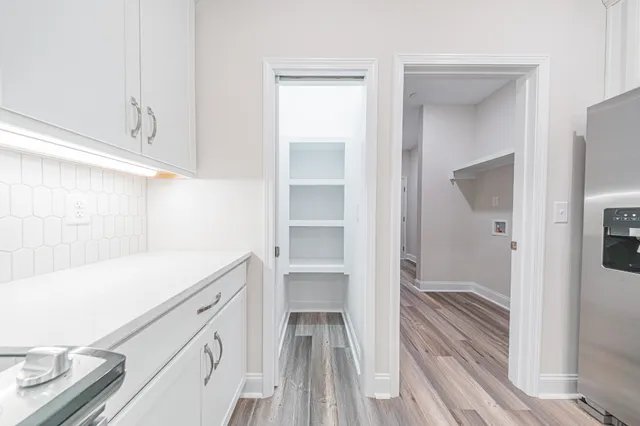 a kitchen with a sink and refrigerator