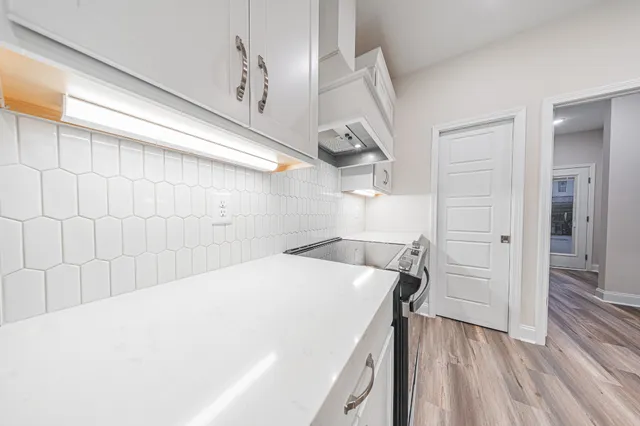 a kitchen with a sink and cabinets